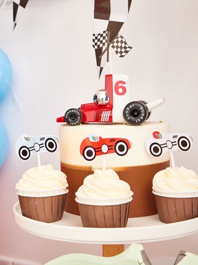 Pekaboay Race Car Themed Children’s Party Supply Kit including cups, cupcake toppers, cutlery, banners, foil balloon, balloon garland, straws, napkins, 7-inch plates, and 9-inch plates