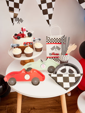 Pekaboay Race Car Themed Children’s Party Supply Kit including cups, cupcake toppers, cutlery, banners, foil balloon, balloon garland, straws, napkins, 7-inch plates, and 9-inch plates